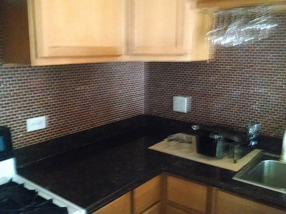 Marble backsplash and granite counter