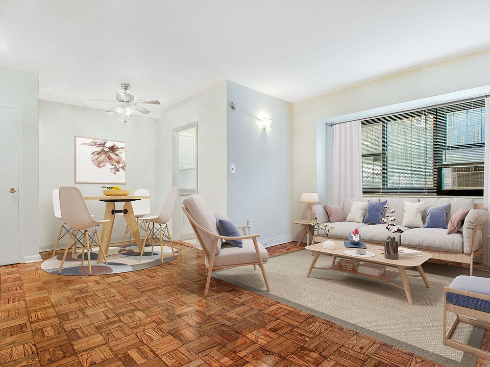 One-bedroom apartment living and dining area (virtually staged)