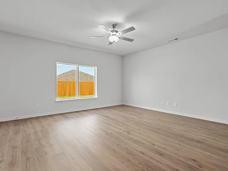 The large living room is spacious and has a large window.