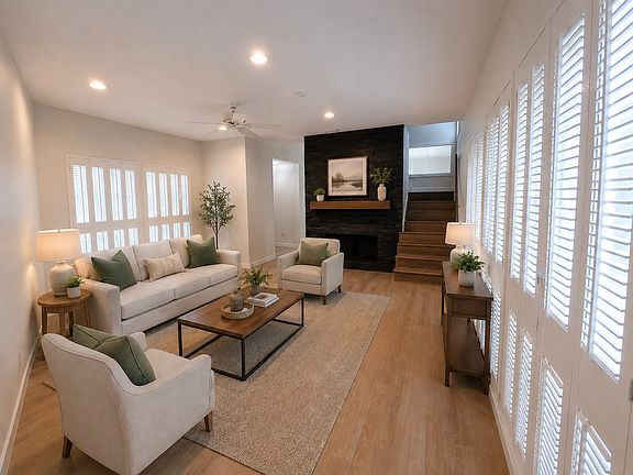 Living Room with built-in shutters and gas fireplace.