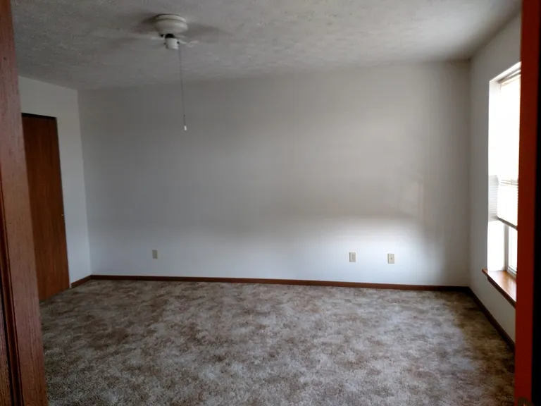 Looking into main bedroom from hallway.