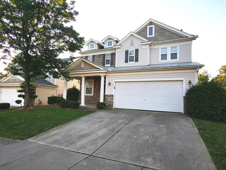 Front porch and 2-car garage