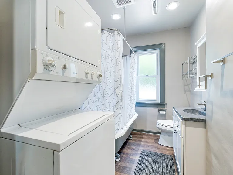 Bathroom with in unuit washer and dryer