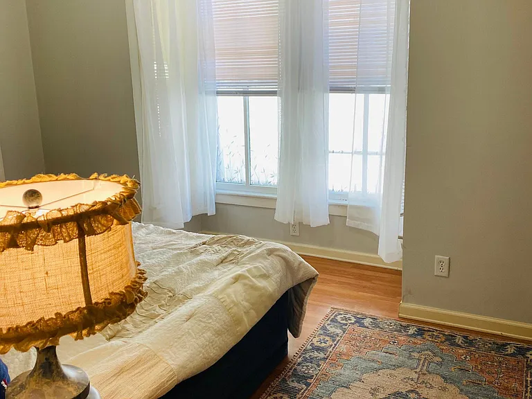 The First bedroom's Bay Windows has new cordless mini-blinds and white linen curtains, which are supplied to lower move-in costs!
