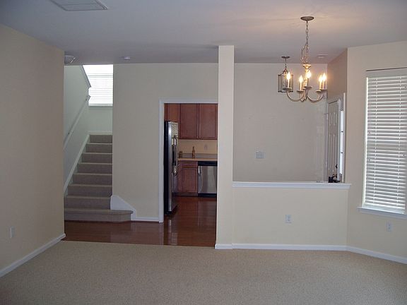 Dining area and stairs leading to 2 upstairs bedrooms