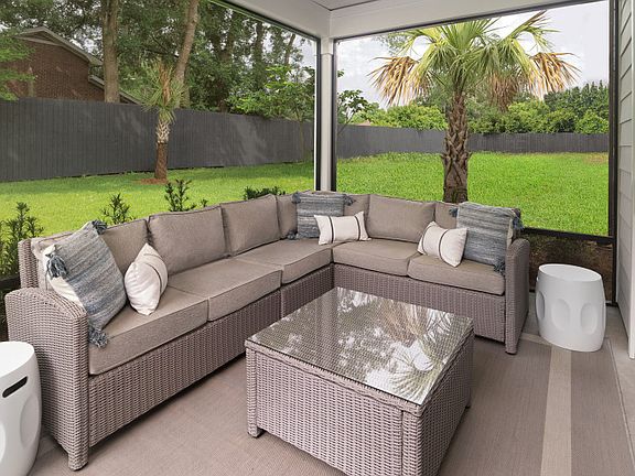 Spacious screened in porch and fire pit on the patio to gather and relax with friends.