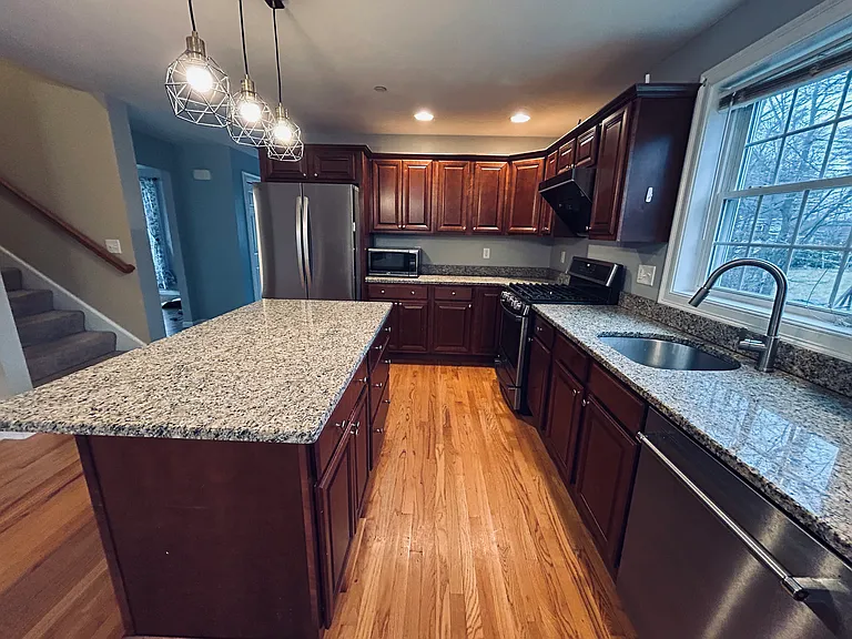 Upgraded kitchen with brand new appliances and gas stove