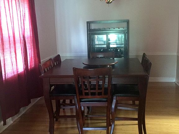 Formal dining room with glistening hardwood floor