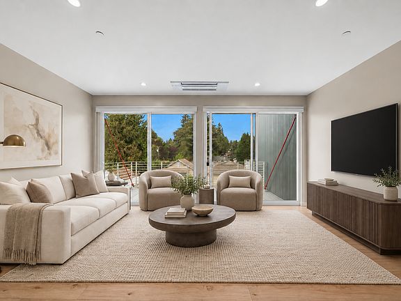 Living room looking towards deck (virtually staged)