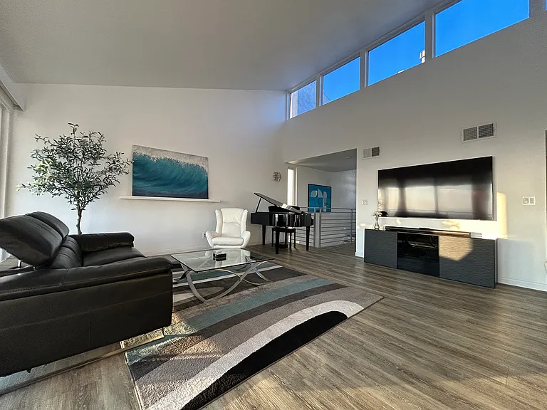 LR bathed in light all day with electric shade control. Fully furnished with modern luxury.