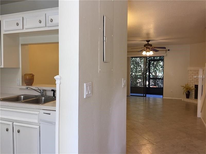 Standing at the front door with a welcoming view to the wooded back yard.