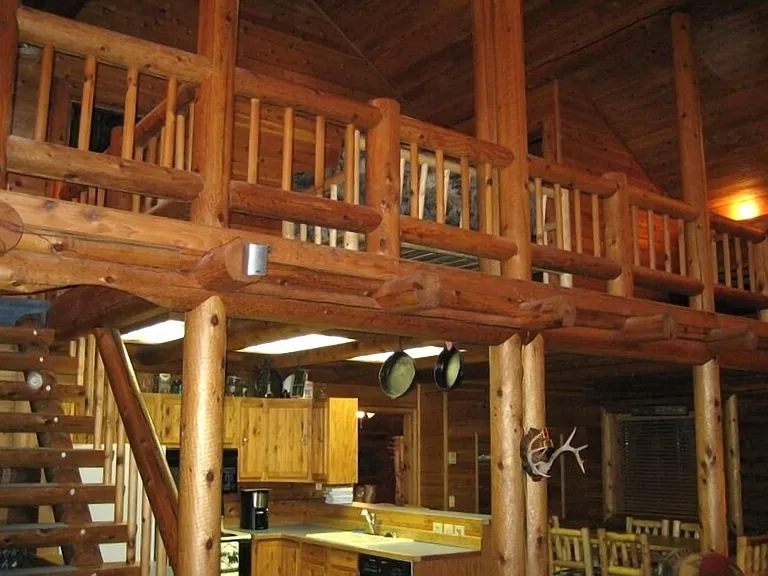 Upstairs features living room space with tv, bathroom and two upstairs bedrooms with lofts in each.