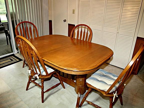 Dining room has LARGE pantry and leads out to an awesome enclosed back porch. Stay tuned for more photos within a few days!!
