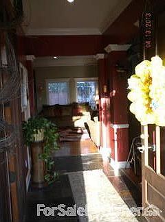BEAUTIFUL ENTRY
						:
						double wood French doors invite you in