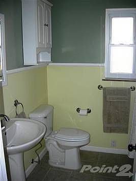 All updated...ceramic tile floors, bath surround, newly glazed tub, new hardware, pedestal sink, mor