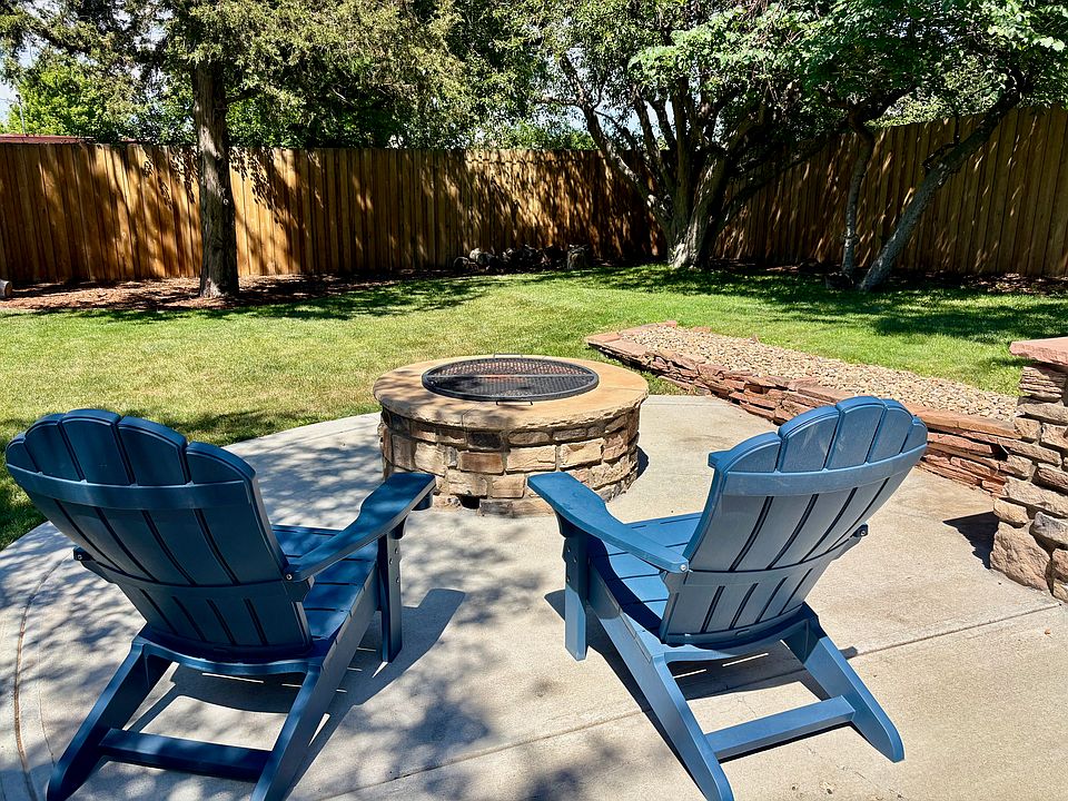 View of the yard from the patio overlooking the firepit.