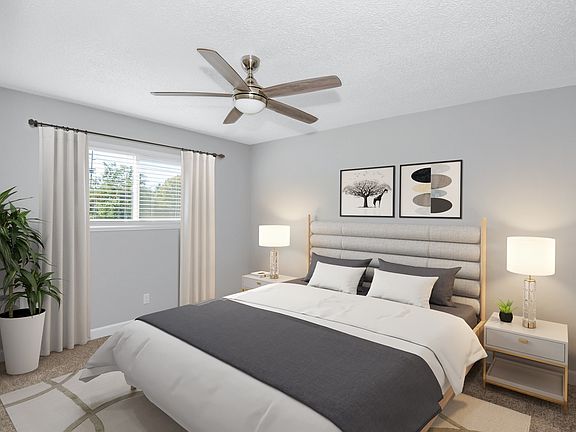 Beautiful primary bedroom with large windows