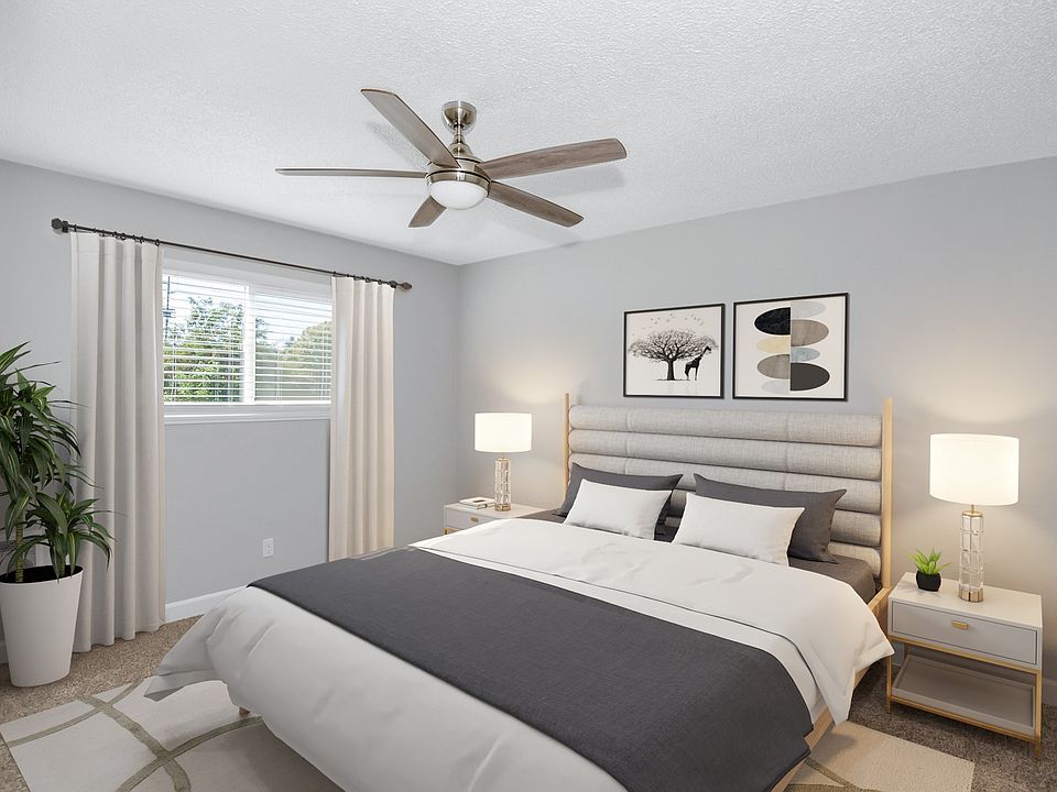 Beautiful primary bedroom with large windows