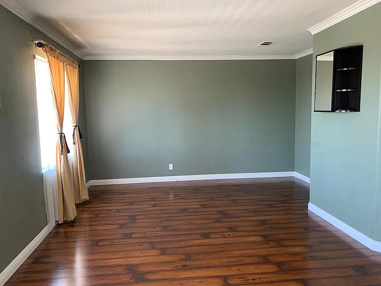 Very large master bedroom with natural light and entertainment space.
