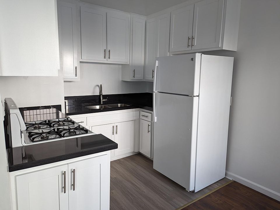 New cabinet facing and wood floors in the kitchen.