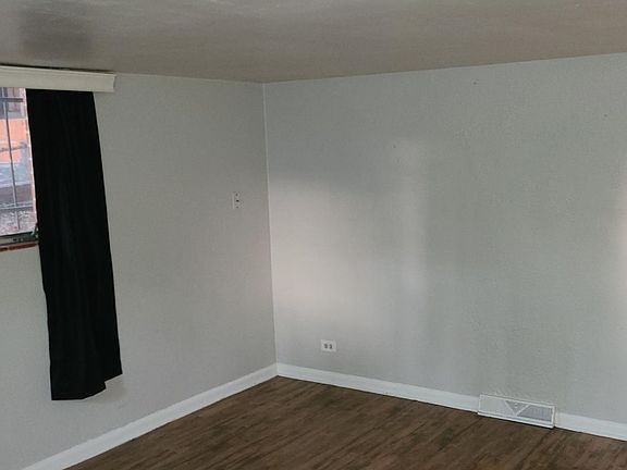 living area showing hall to bedroom and bathroom