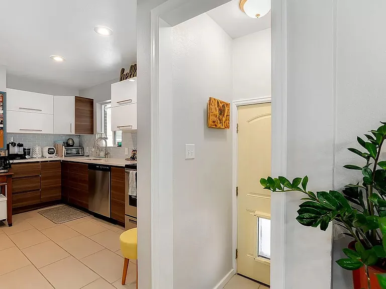 Kitchen/entry to basement, door to backyard