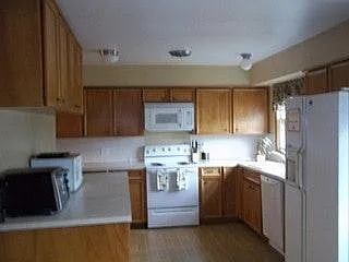 Kitchen: Electric Range, Two Refrigerators, Dishwasher, Microwave