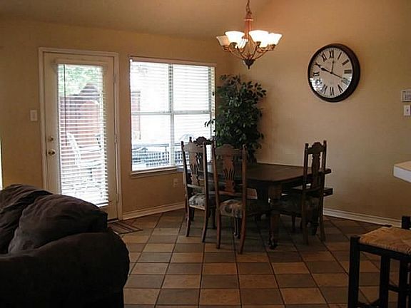 Informal dining room is open to the family and kitchen. Tile floors.