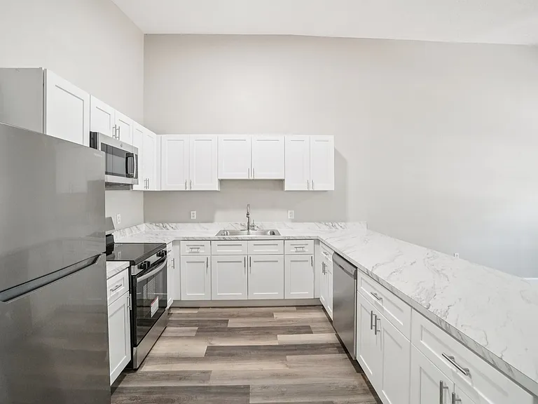 Chef's dream: Brand-new kitchen with stylish countertops and all-new stainless steel appliances.