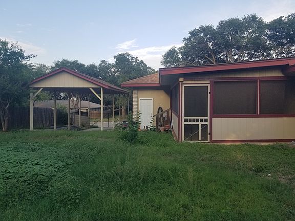 backyard with sunroom and boat storage