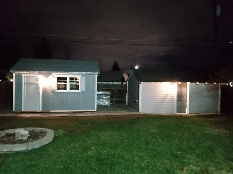Garden shed and one car garage with solar security/motion lights