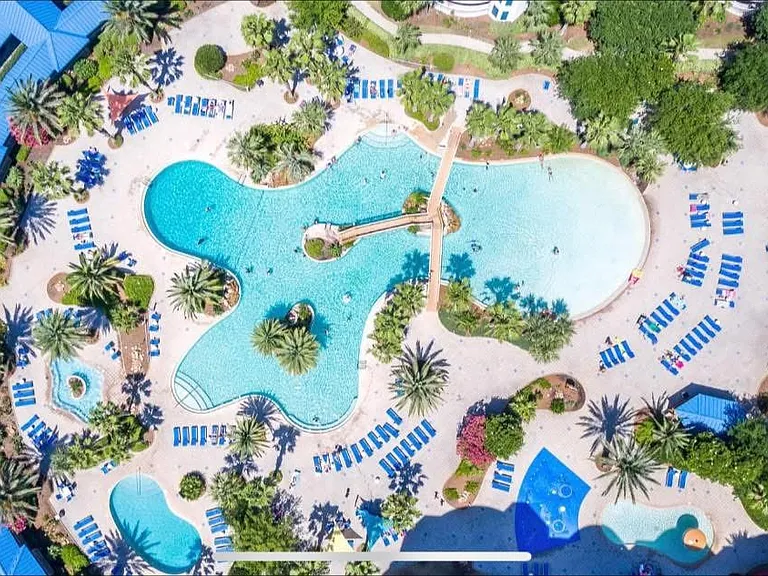 View of the beautiful resort with multiple pools, hot tub, splash pad, bar/restaurant & more!