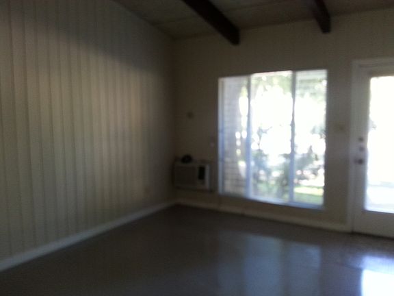 Living room has window a/c unit