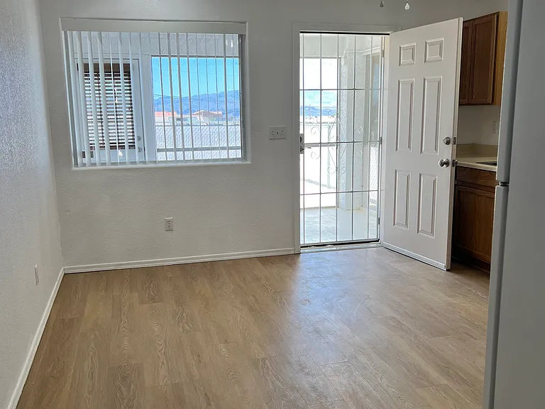 Open door to Arizona room and lake view