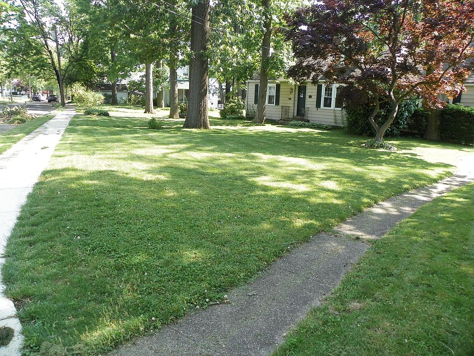 Front sidewalk on the left and 703 sidewalk on the right