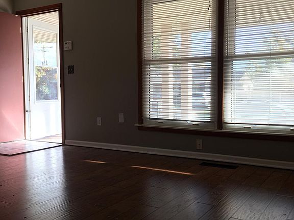 Living room has excellent front windows to let in lots of light.