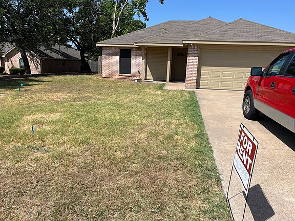 Front of home with 2 car garage and automatic opener.