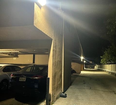 Carport parking area shown well lit at night