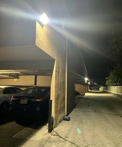 Carport parking area shown well lit at night