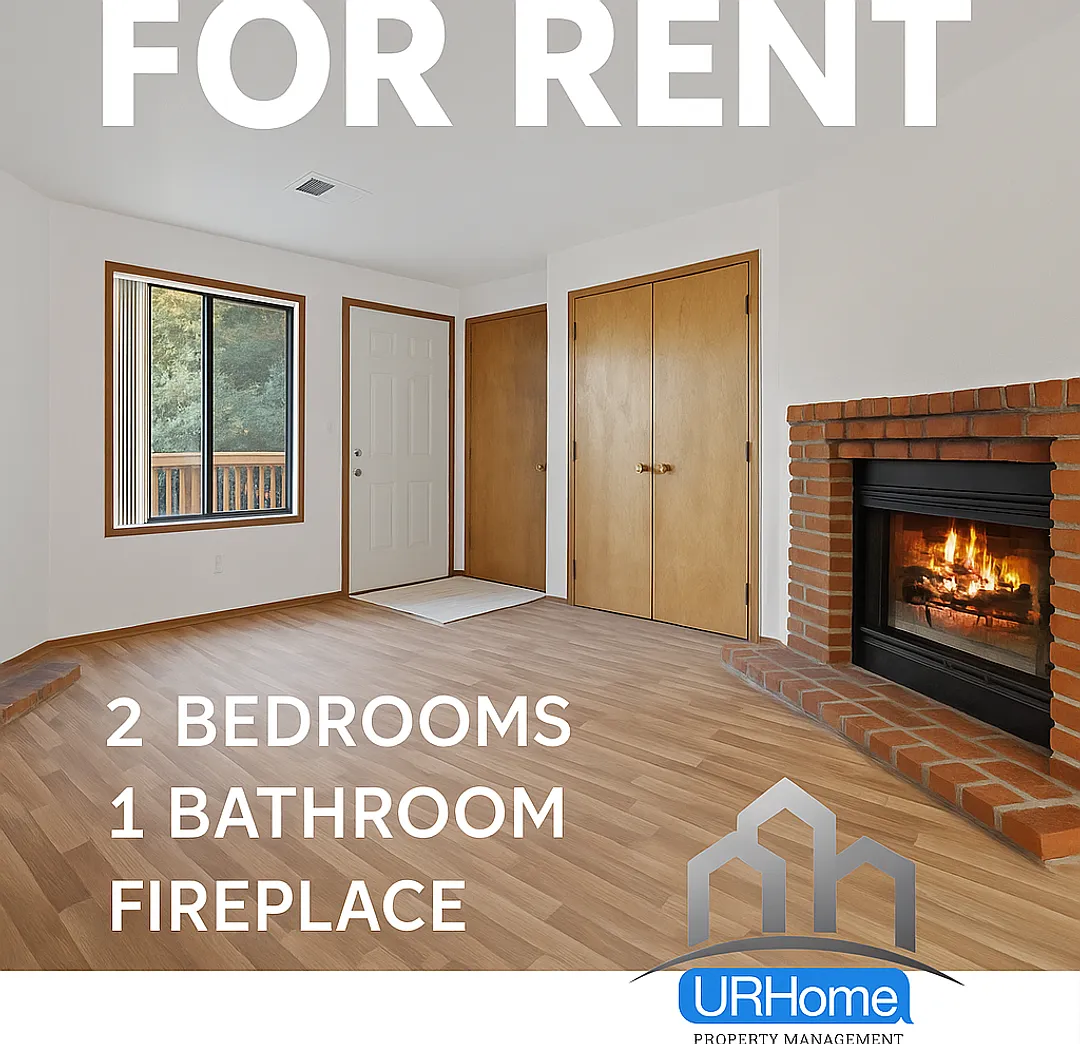 Inviting 2-Bed Retreat | Fireplace, Garage & In-Unit Laundry — Photo 1