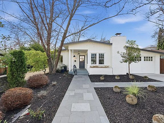 Front of house, Flagstone Walkway, "Carriage house" garage door