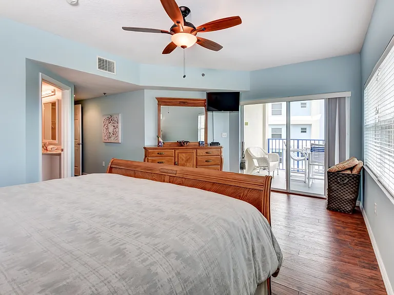 This main master bedroom with the king size bed and oversized room is sure to please. Enjoy a private balcony off of the master bedroom