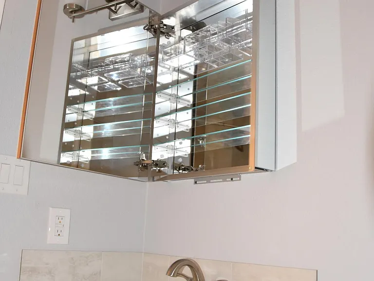 Inside view of the medicine cabinet/mirror. Holds toothbrushes, etc.
