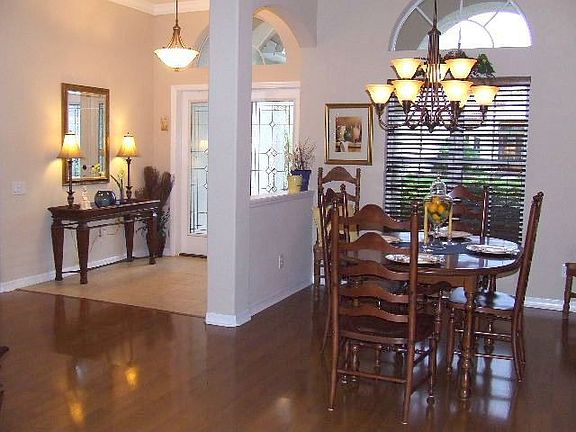 The foyer and dining area as seen from the living room.