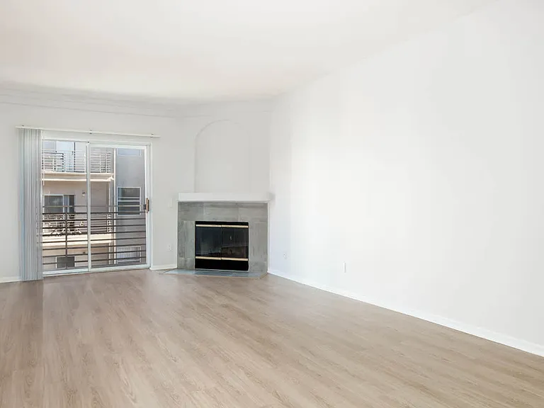 Living Room with Fireplace and Balcony