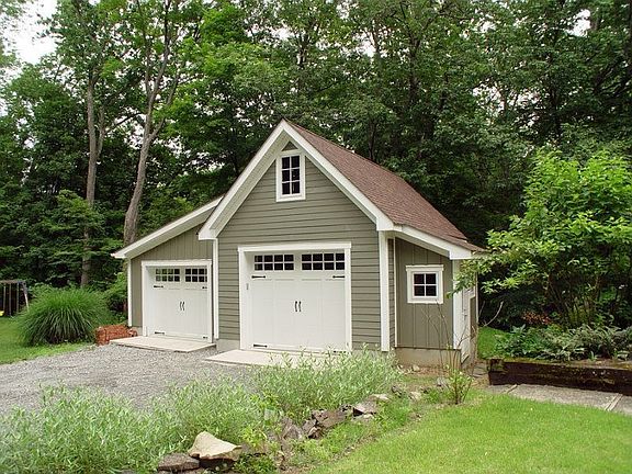 Garage from two-car wide driveway with ample parking for 6 cars.
