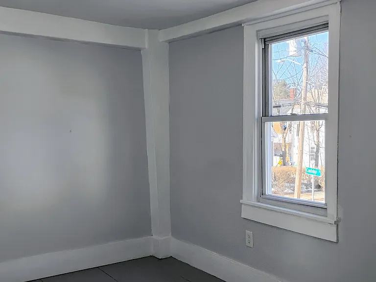 Double hung vinyl replacement windows, set at an level.