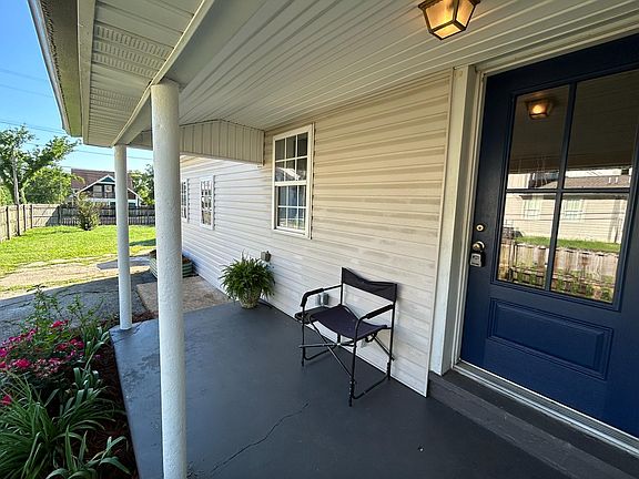 Front Porch. Photo 8am - May 2024 - Big yard with lots of parking and room for yard gatherings.