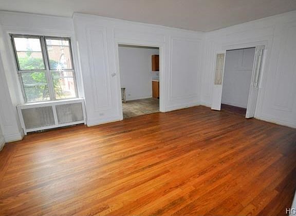 Large Living Room with refinished hardwood floors.