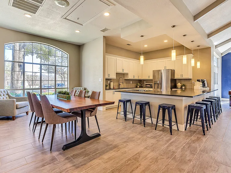 Modern resident lounge with entertainment kitchen, games and lounge seating
